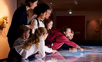 children and their parents at the museum of science